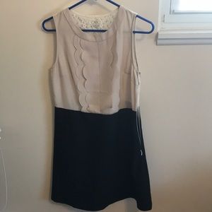 Cream and black cocktail dress.